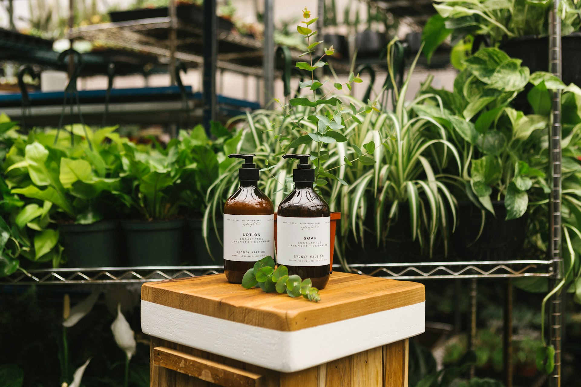 two amber glass pump bottles on top of wooden table